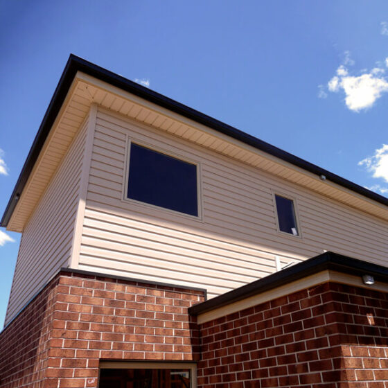 Looking good, new build in Braybrook, Melbourne using a Mitten Vinyl Sandalwood Cambridge profile, installed by Vinyl Cladding Professionals.