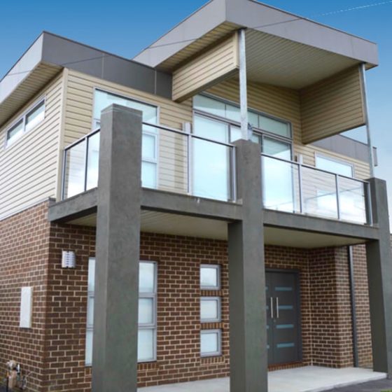 New home with upper storey clad in Cambridge Brownstone cladding profile, St Leonards, Victoria. Installed by Vinyl Cladding Professionals.